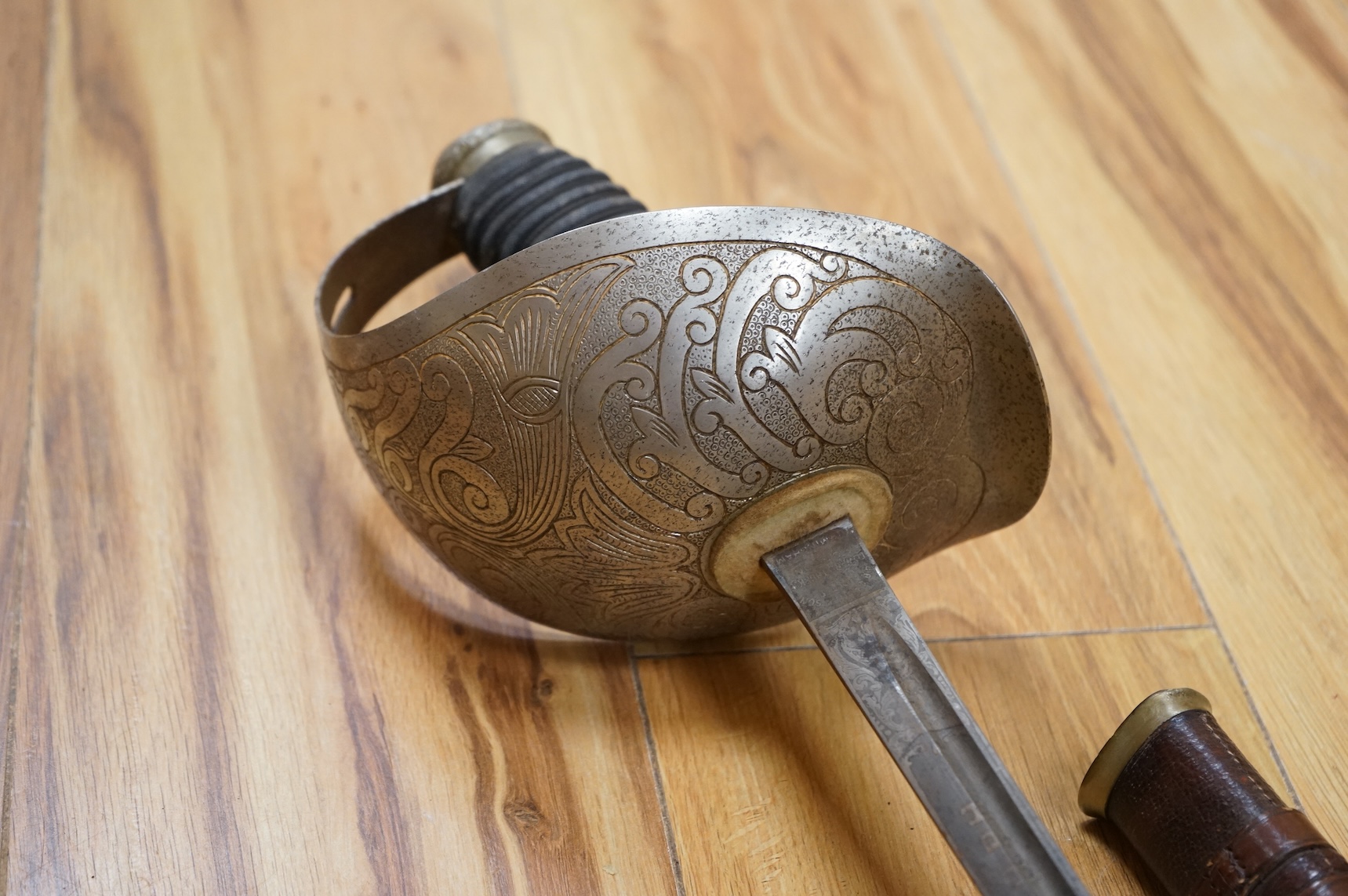 A 1911 pattern cavalry officer’s sword by J. Gaunt and son, etched with crowned GVR cipher and owner’s initials; HPH, regulation hilt and leather covered scabbard